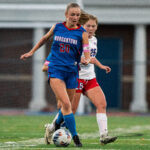 Morgantown's LIllian Staples (20) rushes down center field with the ball against Wheeling Park in sectionals.